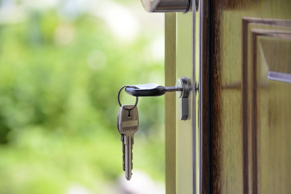 open wooden door with keys as analogy for open ended dystopian story ideas