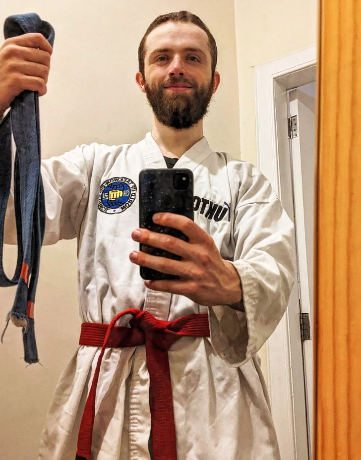 stewart storrar with his red belt in martial arts ITF taekwon-do